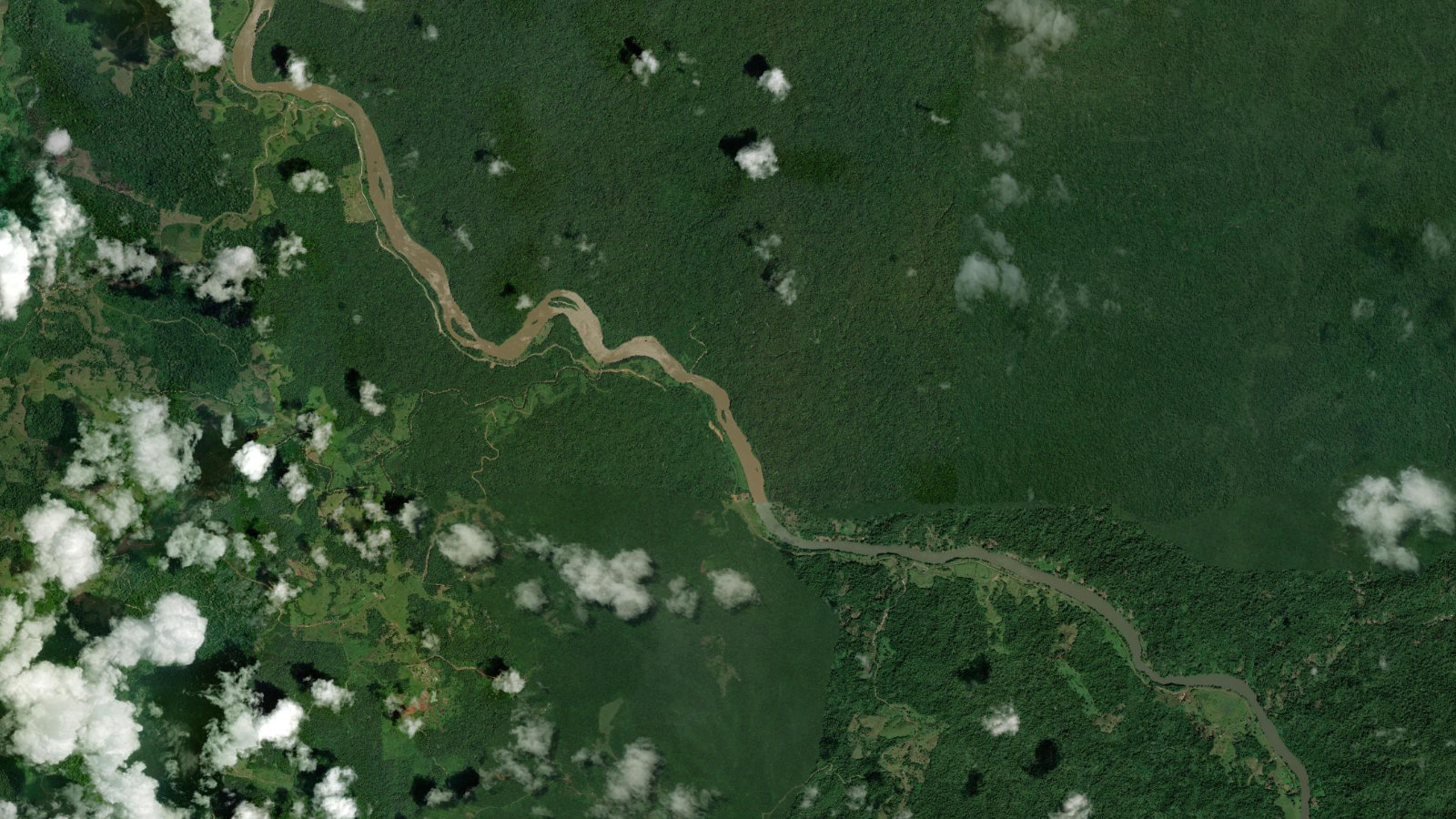 Satellite view of the forested Cutris de San Carlos district in northern Costa Rica, showing the San Juan river corridor that marks the Nicaraguan border near the Crucitas gold deposit.