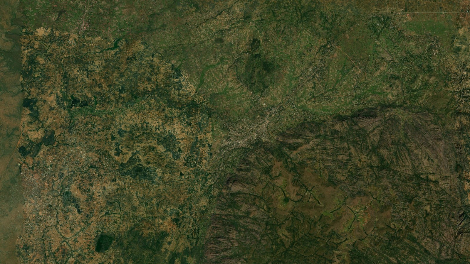 Satellite view of the green hill country of southern Kaduna State in Nigeria's Middle Belt, part of the lithium-bearing belt where Jupiter Lithium holds its contested tenements.