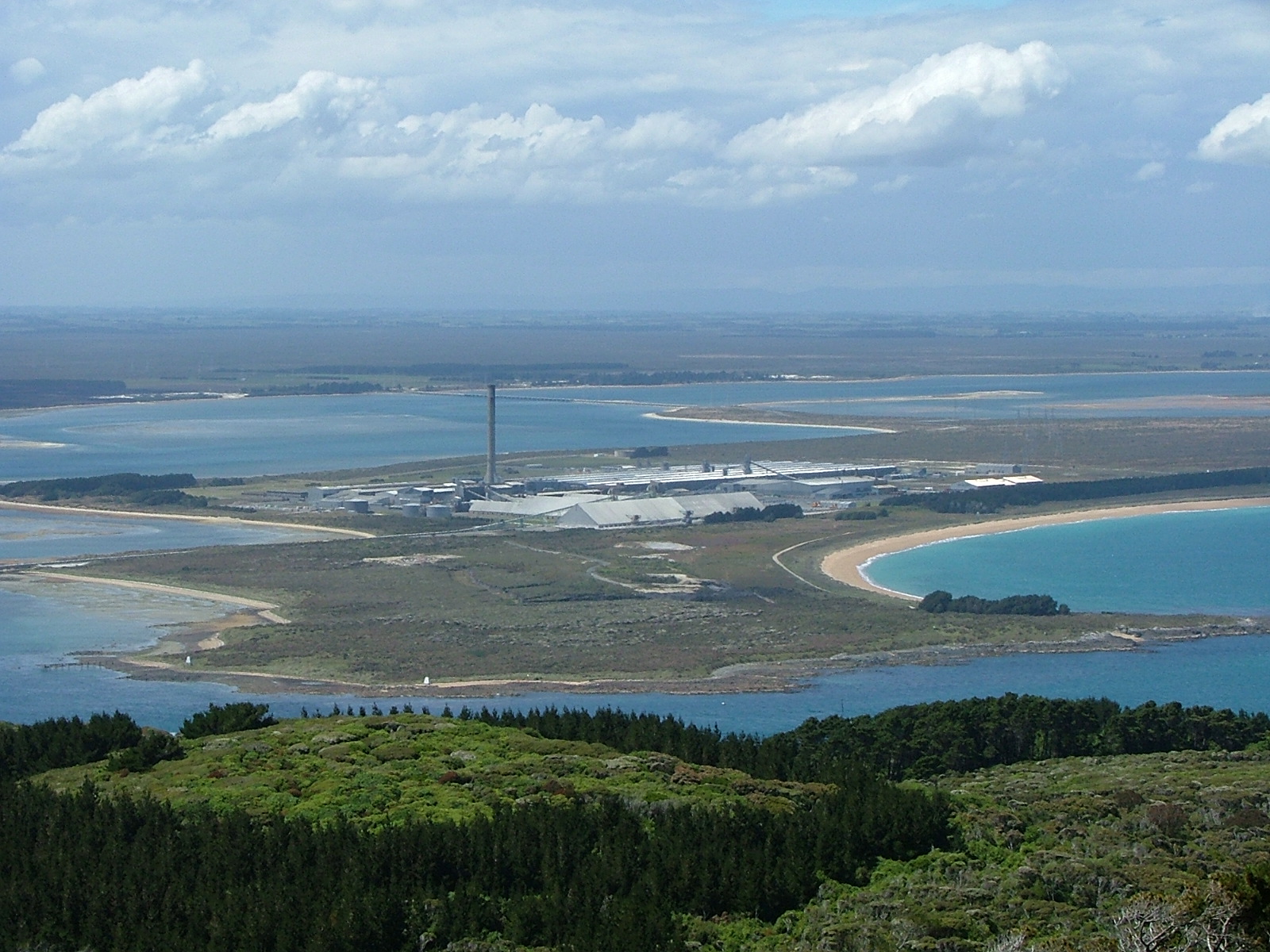 The Tiwai Point aluminium smelter in New Zealand, shown as an illustration of the kind of facility byproduct recovery targets.